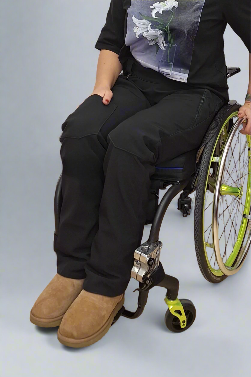 woman in a wheelchair wearing warm softshell adaptive pants from Vilber's 