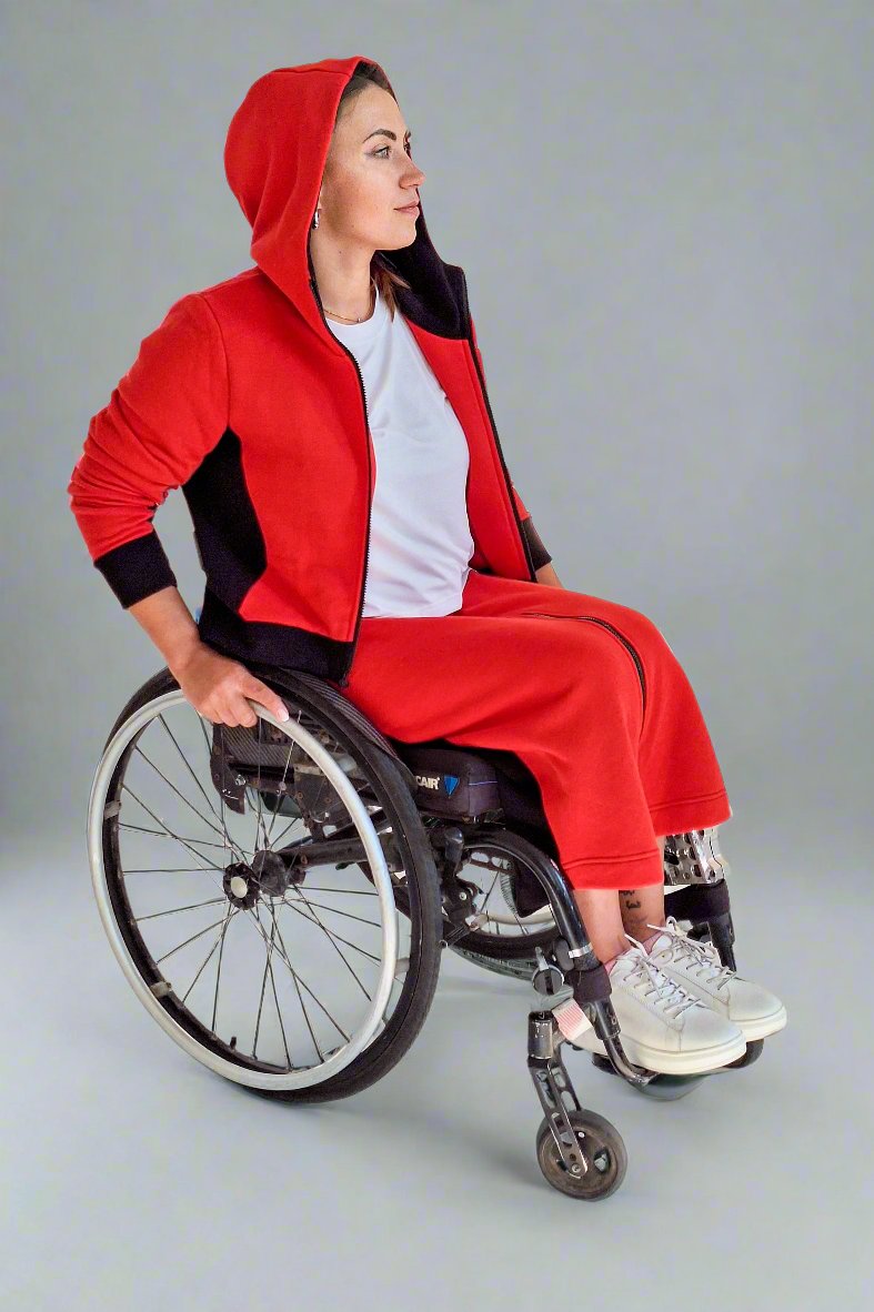 Woman in wheelchair dressed in red adaptive clothing by Vilber's